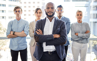 Buy stock photo Portrait of a group of businesspeople standing with their arms crossed in an office