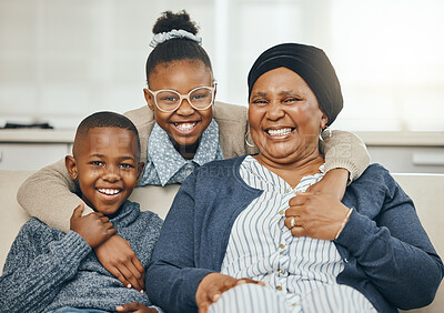Buy stock photo Shot of a grandmother bonding with her grandkids on a sofa at home