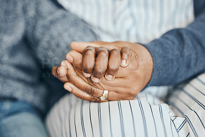 Buy stock photo Cropped shot of a grandmother and grandson holding hands at home