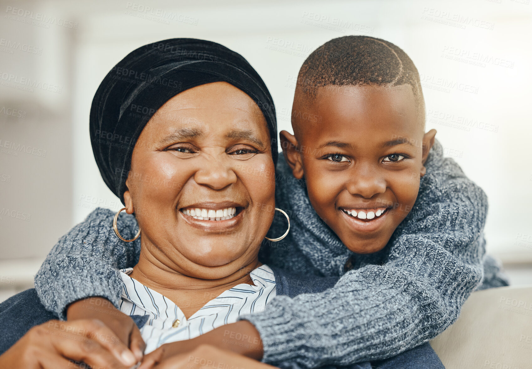 Buy stock photo Shot of a grandmother bonding with her grandson on a sofa at home