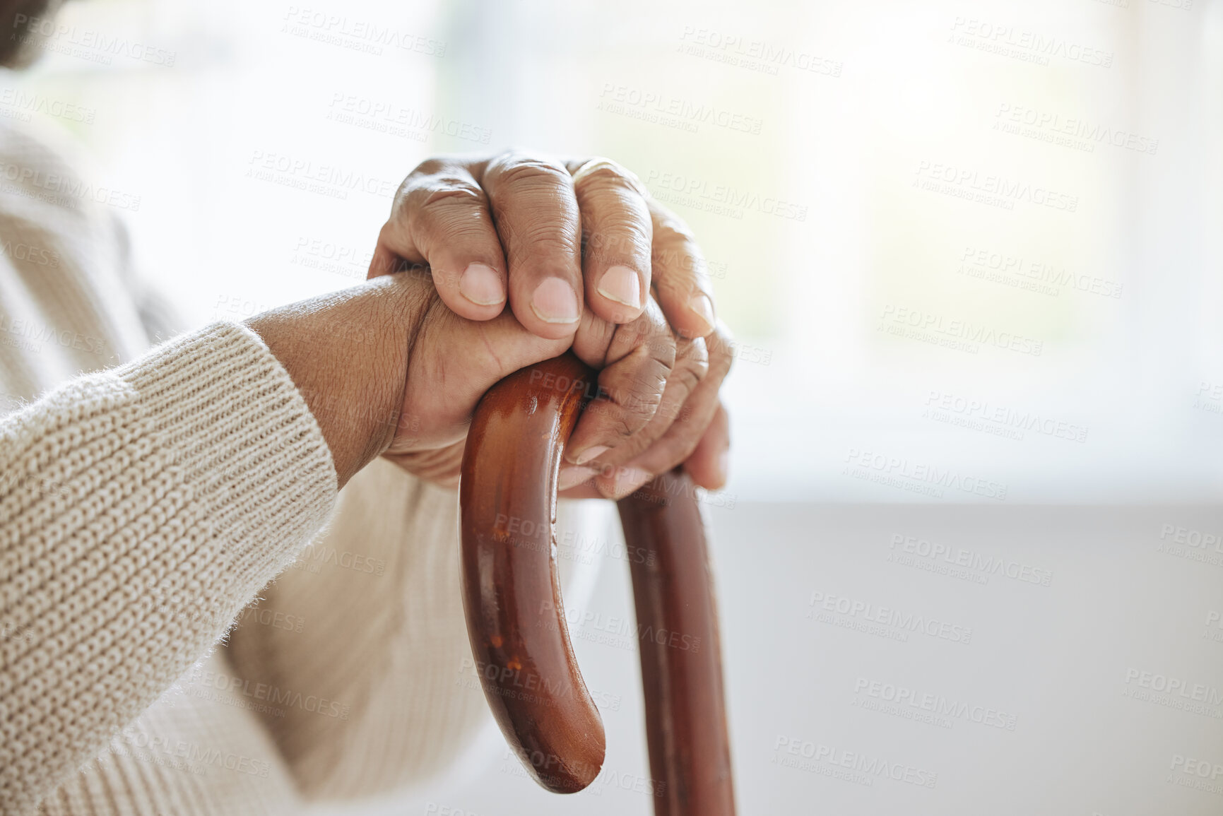 Buy stock photo Hands, retirement and walking stick with senior person closeup in home for balance or stability. Recovery, rehabilitation or wellness and elderly resident with disability in apartment for support