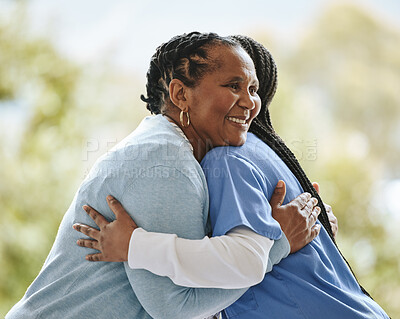 Buy stock photo Senior patient, woman nurse and hug outdoor for support, healthcare and happiness at retirement home. Black person and caregiver together for trust, elderly care and help for health and wellness 