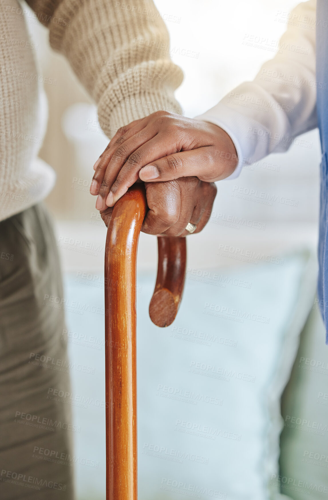 Buy stock photo Elderly patient, cane and nurse holding hands for support, healthcare and kindness at nursing home. Senior person and caregiver together for homecare, rehabilitation or help for health in retirement 