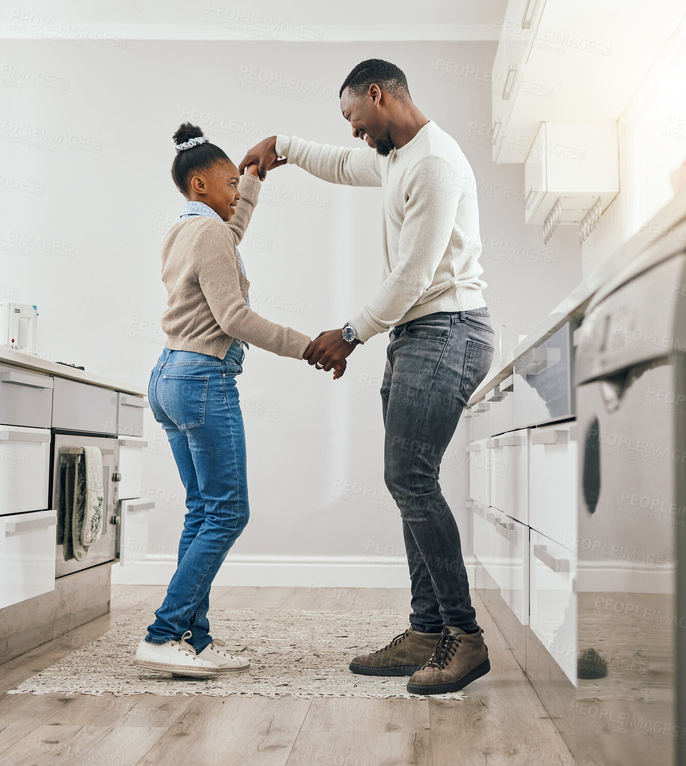 Buy stock photo Home, dancing and father with girl in kitchen, love and bonding together with happiness. Black family, single parent and dad with daughter, movement and energy with support, smile and care with joy