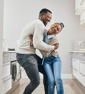 Buy stock photo Shot of a young father and daughter dancing at home
