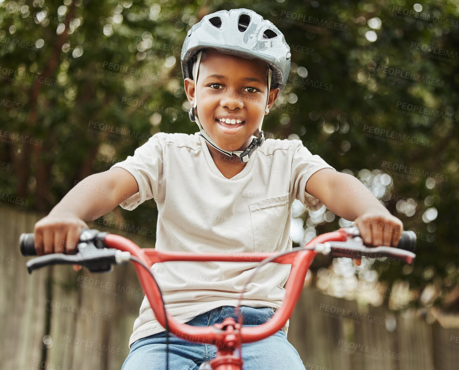 Buy stock photo Black child, portrait and riding with bicycle or helmet for fun activity, hobby or outdoor exercise in nature. Young African, little boy or kid smile with bike for weekend of cycling in neighborhood