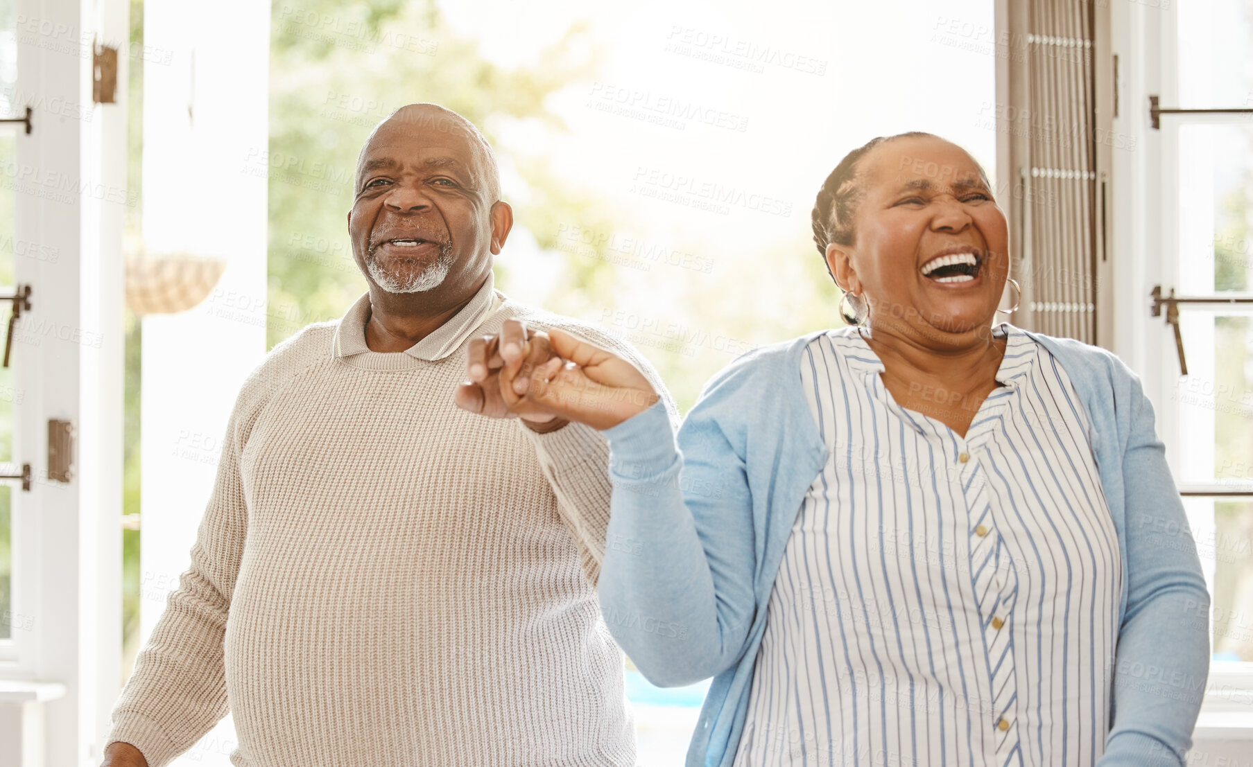 Buy stock photo Black couple, retirement and dance in home for love, happiness and trust in relationship. Elderly man, wife and holding hands for care with bonding, fun and excited for milestone with celebration