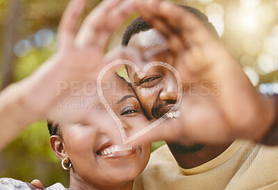 Buy stock photo Shot of an affectionate couple forming a heart shape with their hands while standing outside