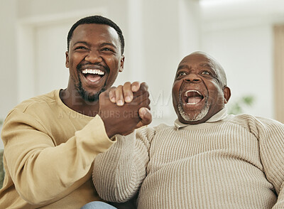 Buy stock photo Shot of a father and son laughing in the lounge