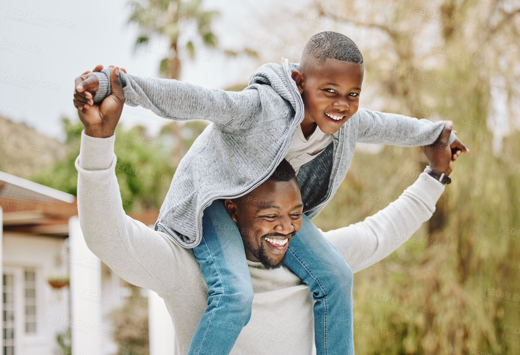 Buy stock photo Portrait, nature and black child on shoulders of father for playing, having fun and bonding together. Happy, airplane and African dad carrying boy kid for connection at outdoor park in Nigeria.