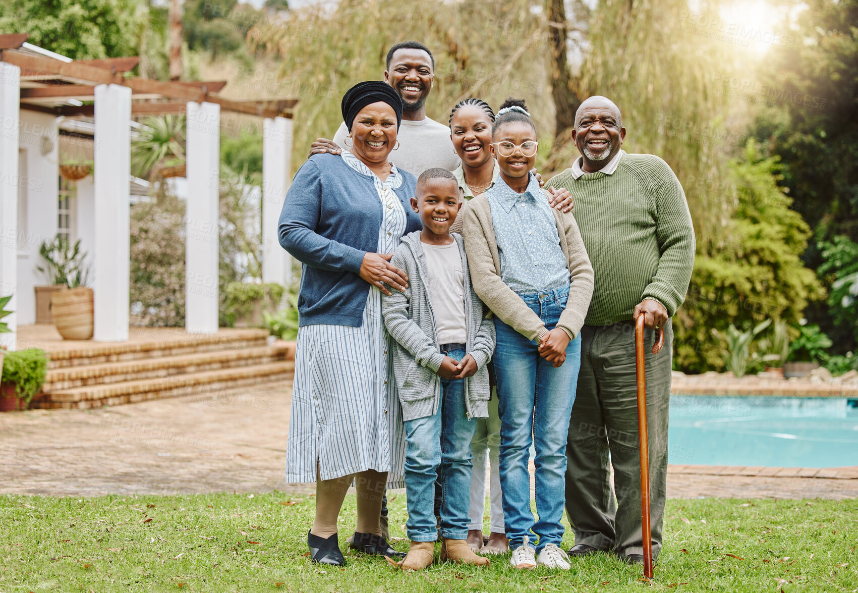 Buy stock photo Smile, generations and portrait of black family in backyard of new home for bonding, connection and love. Mortgage, outdoor and African children with parents and grandparents in garden in Botswana.