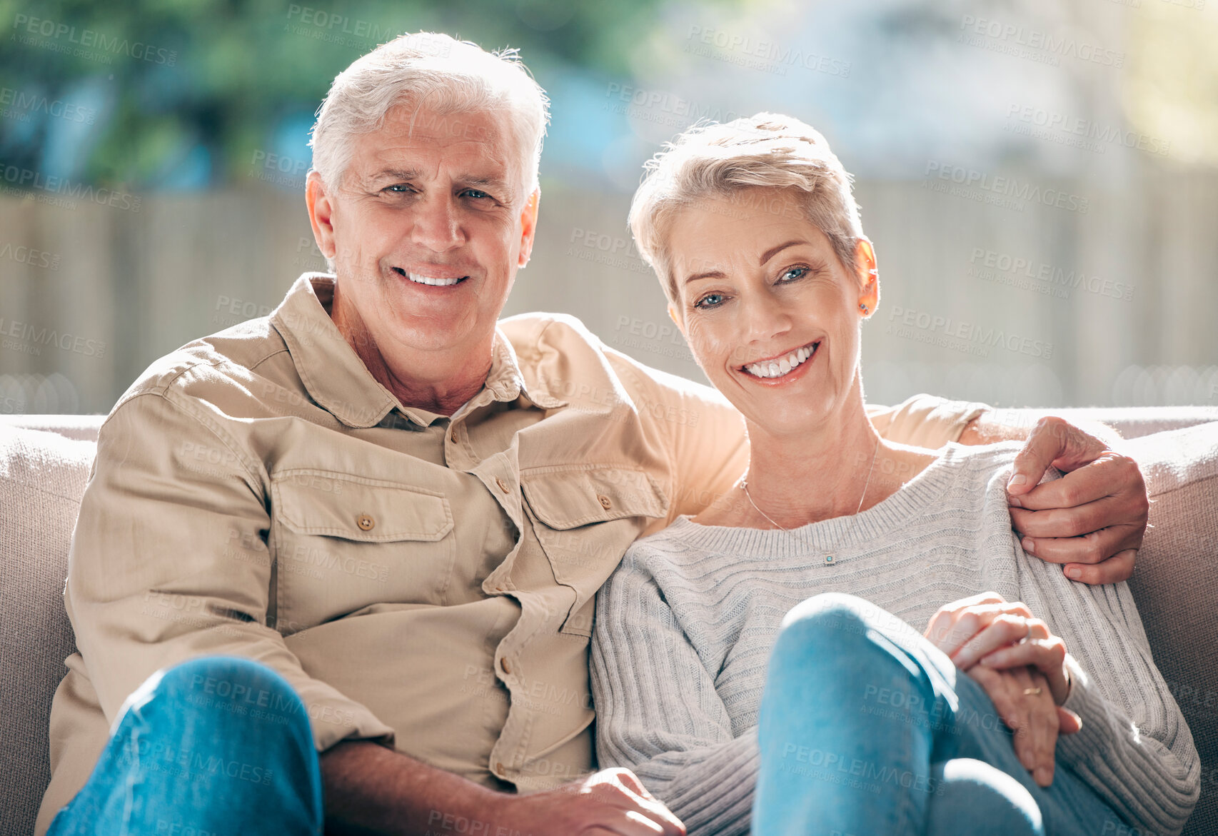 Buy stock photo Portrait of a happy senior couple relaxing on the sofa at home