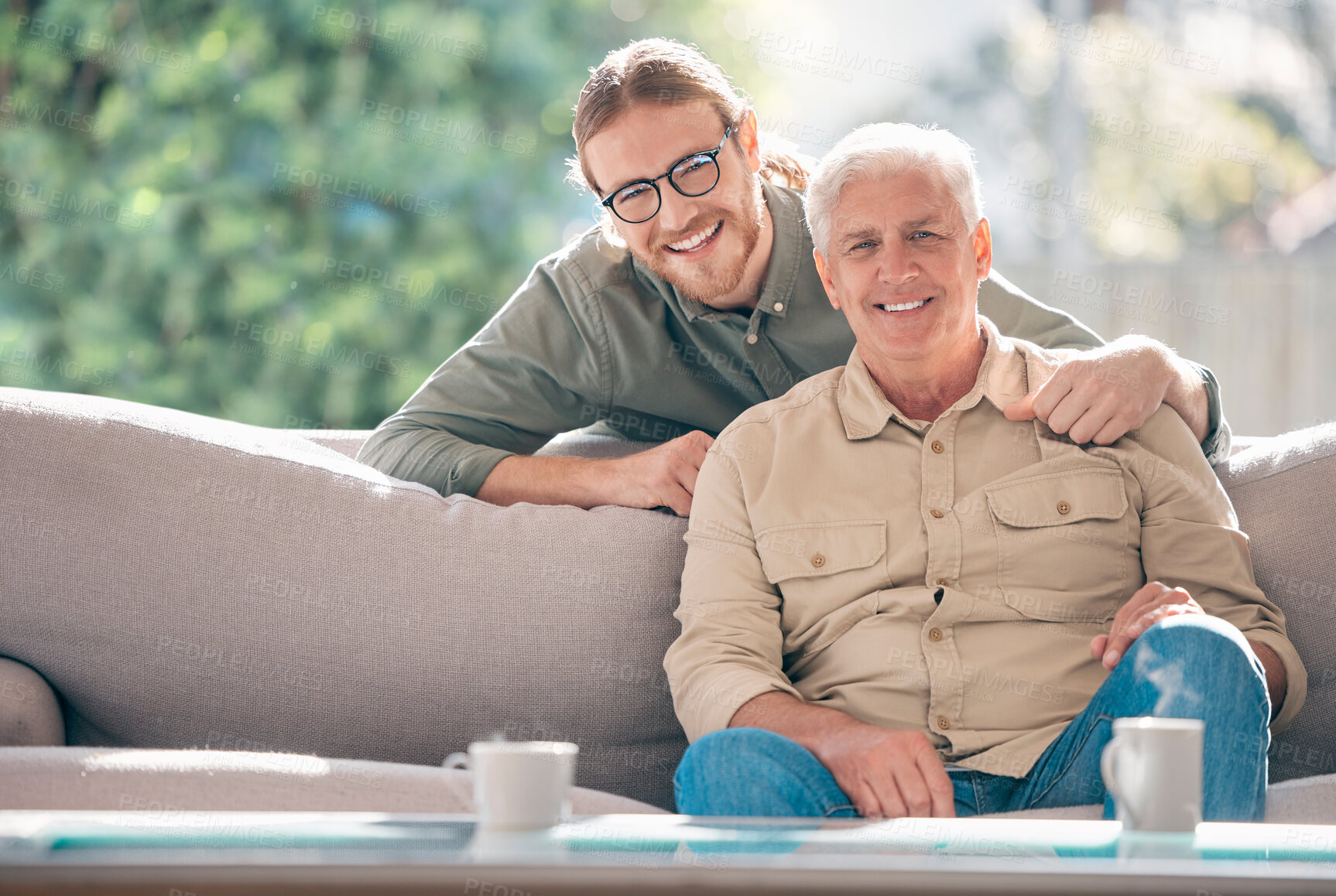 Buy stock photo Happy, portrait and man with senior dad on sofa to relax together for fathers day, care or support. Smile, family and proud elderly male parent with person or son for bonding in living room in home