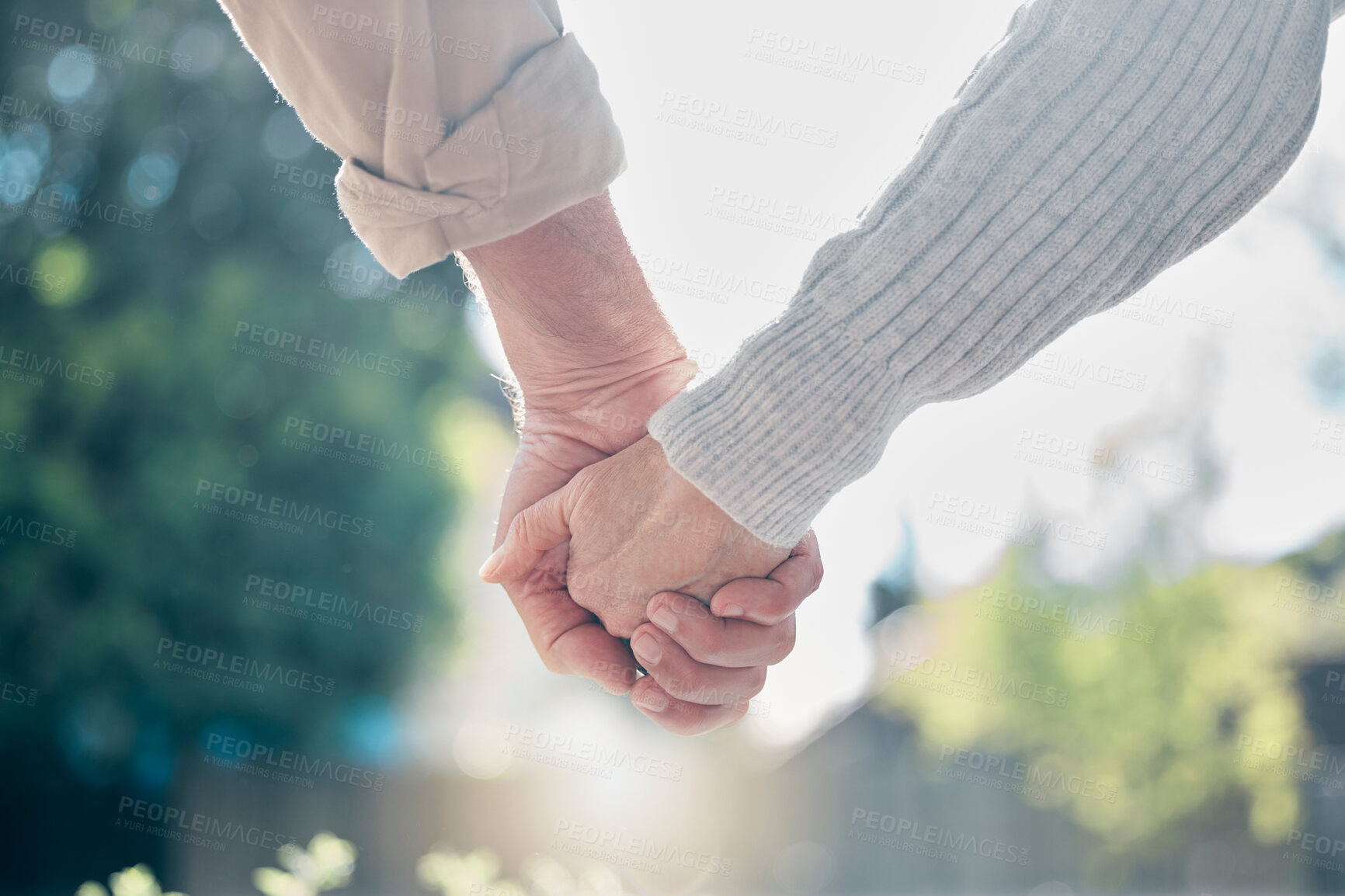 Buy stock photo Senior couple, holding hands and love in support, care or relationship in nature garden or park outdoors. Hand of elderly man and woman touching in loving romance, trust or partnership together