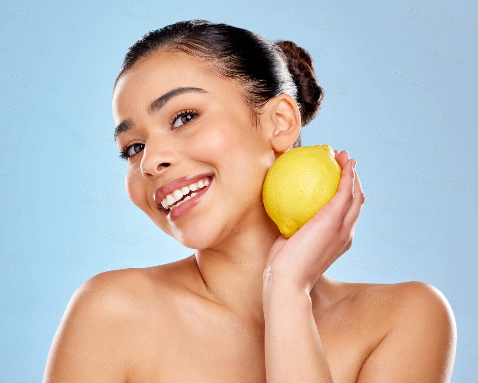Buy stock photo Woman, lemon and beauty portrait with vitamin c for skincare, natural glow and vegan nutrition for skin health in studio. Female person, dermatology and citrus fruit for detox by blue background