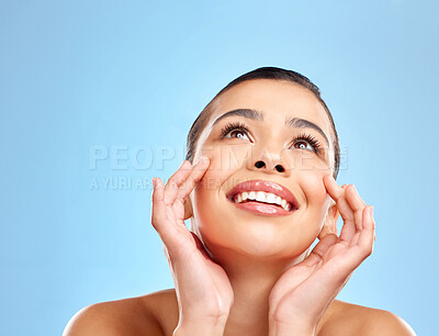 Buy stock photo Woman, beauty and thinking for skincare with smile, wellness and healthy shine with skin glow in studio mockup. Female person, face touch and dermatology ideas for cosmetic results by blue background