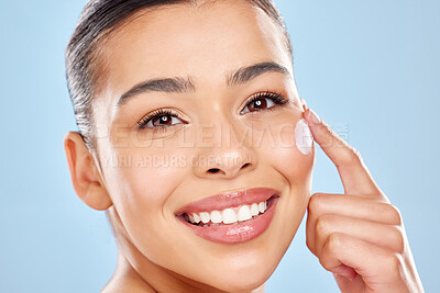 Buy stock photo Cream, portrait and happy woman in studio with hand for skincare treatment, cosmetics or dermatology spa on blue background. Closeup, beauty and model with smile for shine, moisturizer or wellness