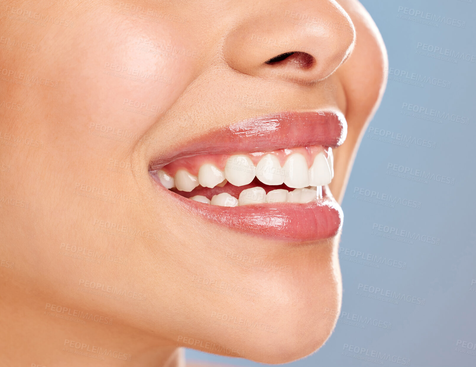 Buy stock photo Woman, mouth and teeth in studio for dental hygiene, oral and healthcare on blue background. Female person, orthodontics and whitening treatment for grooming, clean and veneers for transformation