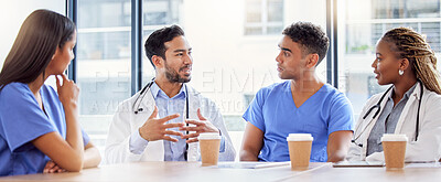 Buy stock photo Shot of a group of doctors in a meeting at work