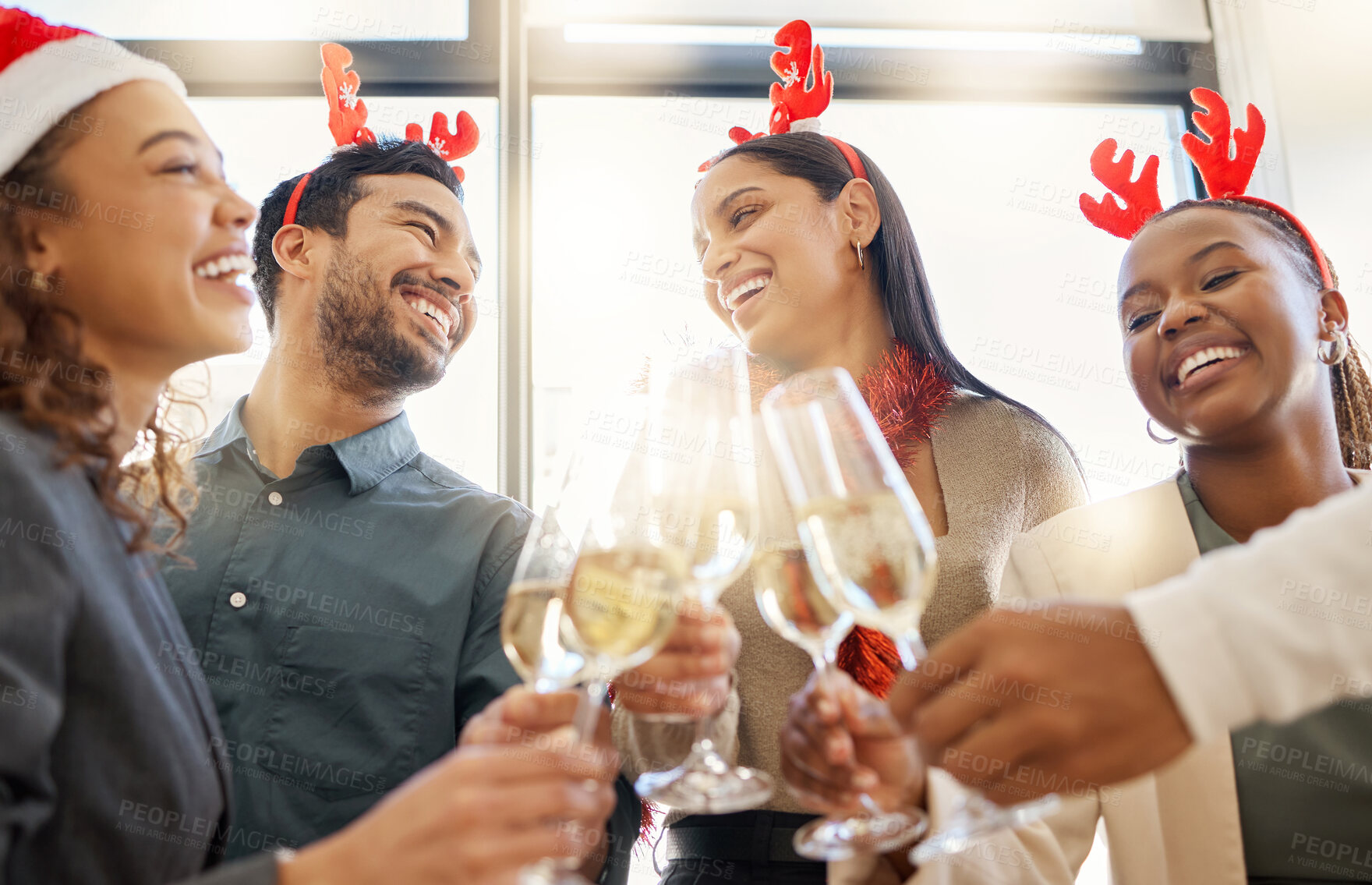 Buy stock photo Christmas, toast and friends with drink in office for party celebration, social gathering and company lunch. Happy team, diversity and group of people with champagne for festival, cheers or holiday