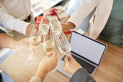 Buy stock photo Shot of a group of unrecognizable businesspeople toasting at work