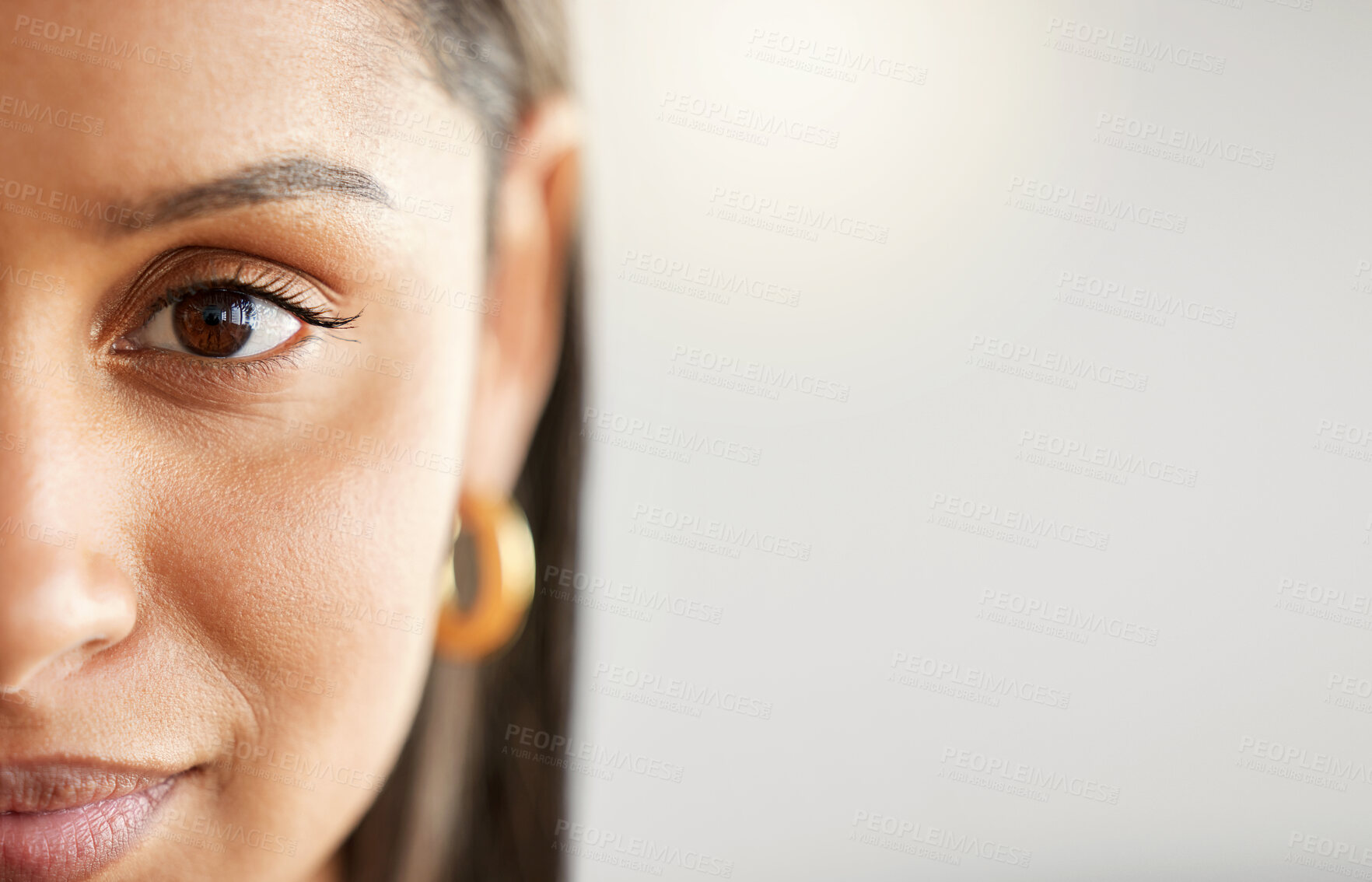 Buy stock photo Woman, eye and face portrait with space for mockup, advertising or vision on a studio background. Zoom and half headshot of a female person or student with natural beauty, focus and concentration