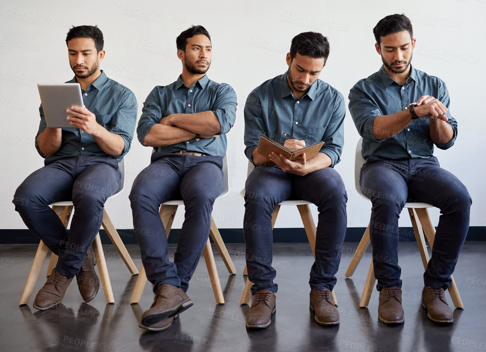 Buy stock photo Shot of a young businessman waiting in a line in a modern office