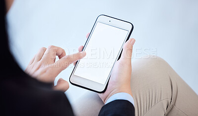 Buy stock photo Shot of an unrecognizable businesswoman using a smartphone in a modern office