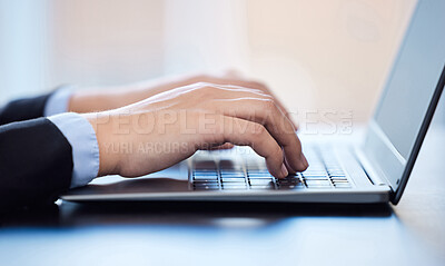 Buy stock photo Shot of an unrecognizable businesswoman using a laptop in a modern office