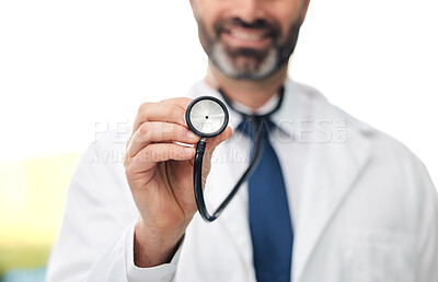 Buy stock photo Shot of an unrecognizable doctor holding up a stethoscope at a clinic