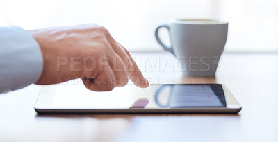 Buy stock photo Shot of an unrecognizable businessperson using a digital tablet at work