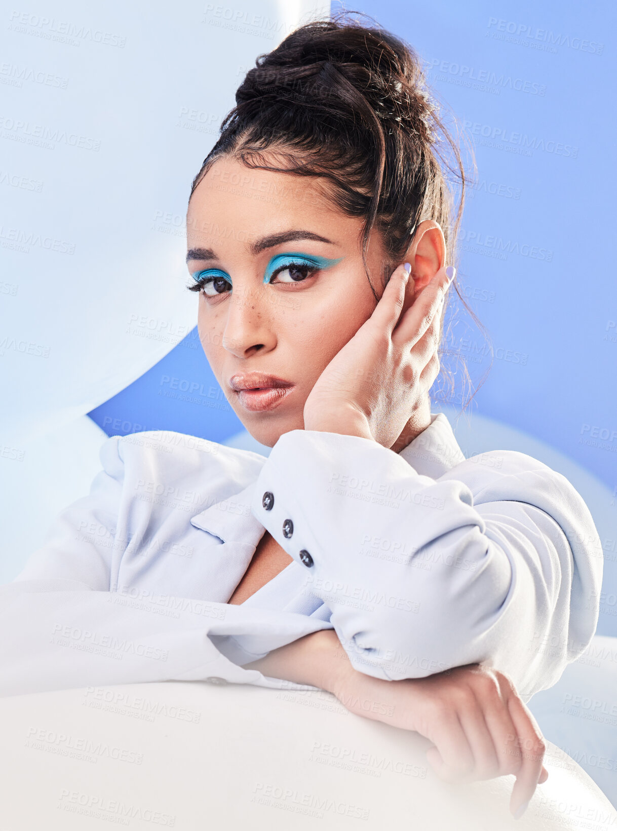 Buy stock photo Studio shot of an attractive young woman posing with balloons against a blue background