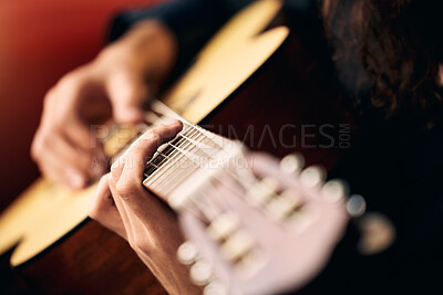 Buy stock photo Cropped shot of an unrecognizable man playing guitar