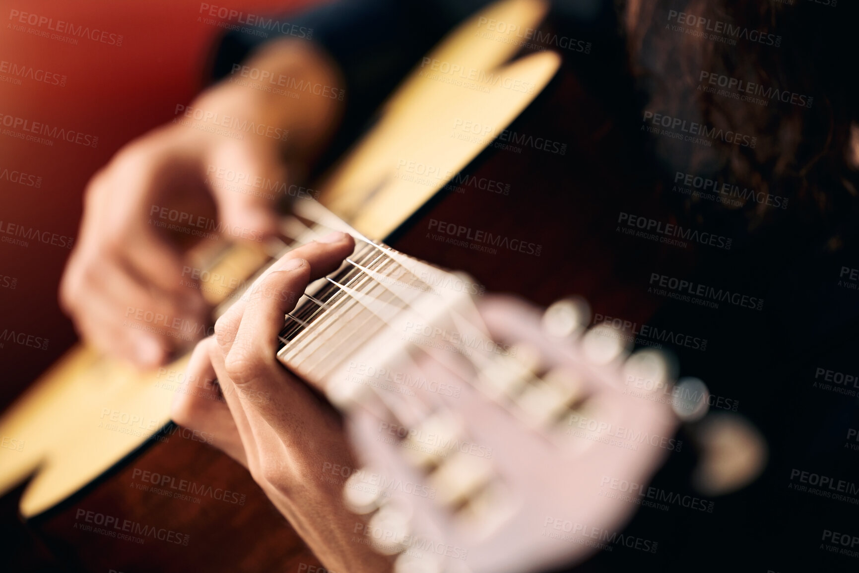 Buy stock photo Cropped shot of an unrecognizable man playing guitar