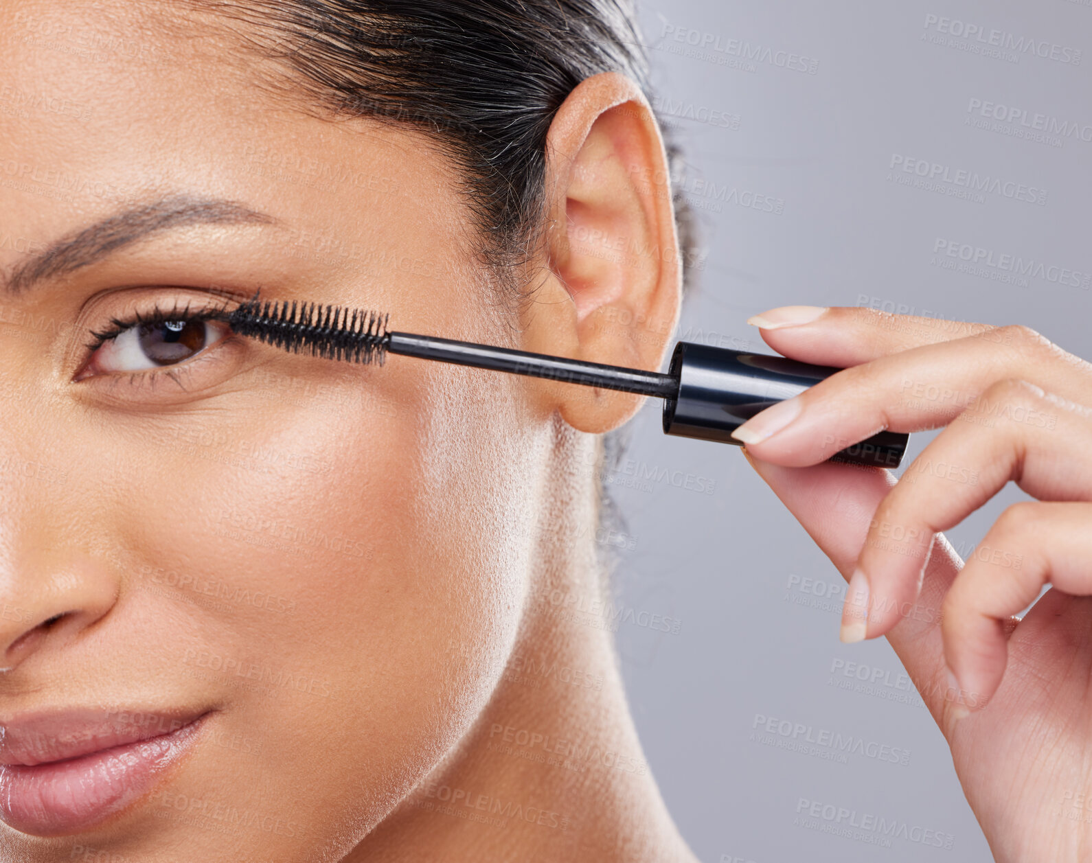 Buy stock photo Portrait, mascara and portrait of woman in studio for makeup, cosmetics and results on grey background. Eyelash, curling and face of Indian female model with tool for treatment, application or volume