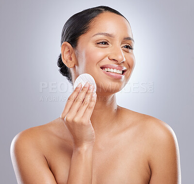 Buy stock photo Cotton pad, beauty and woman in studio with natural, health and fresh facial treatment. Smile, skincare and female person with cosmetic face product for dermatology routine by gray background.
