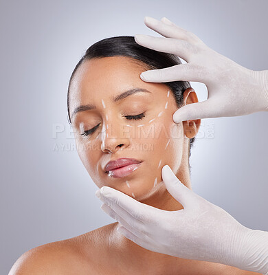 Buy stock photo Hands, face and woman in studio for plastic surgery with dermatology, beauty and cosmetic procedure. Surgeon hand, grey background and patient for anti aging with facelift and transformation results