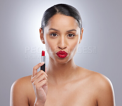 Buy stock photo Red lipstick, woman and portrait in studio for kiss, pout and makeup or beauty on gray background. Female person, lips and attitude for romance, skin glow and cosmetics for product or lip color