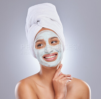 Buy stock photo Shot of an attractive young woman posing alone in the the studio with a face mask on