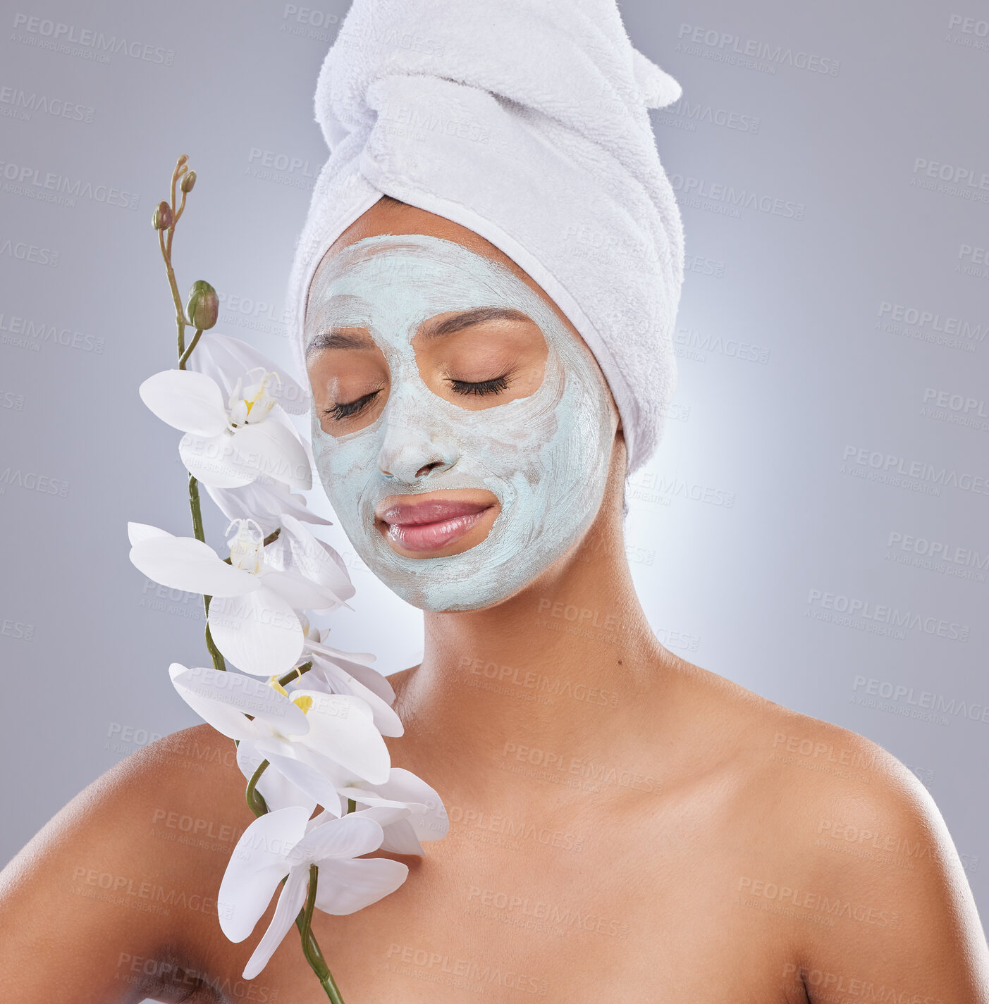 Buy stock photo Orchid, woman and face mask for skincare, cosmetic and facial treatment on white background. Beauty, natural or portrait for female person, plant and dermatology for detox and exfoliate product