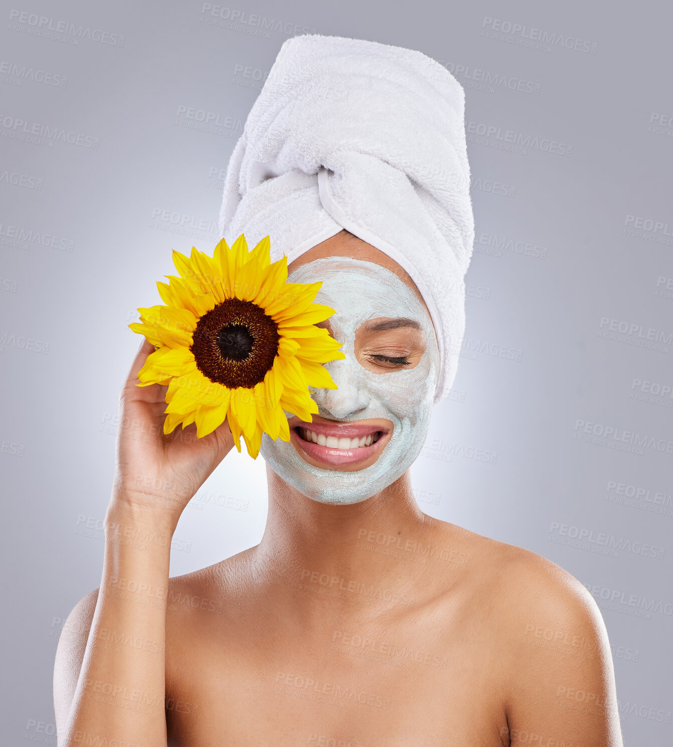 Buy stock photo Sunflower, woman and face mask for skincare, cosmetic and facial treatment on white background. Beauty, natural or organic for female person, smile and dermatology for detox and exfoliate product