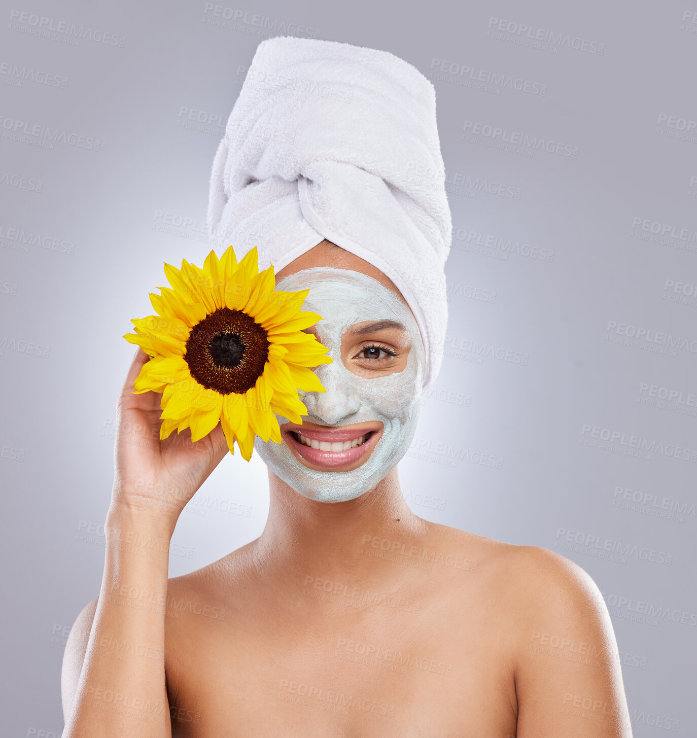 Buy stock photo Sunflower, woman and face mask for skincare, cosmetic and facial treatment on white background. Beauty, natural or organic for female person, portrait and dermatology for detox and exfoliate product