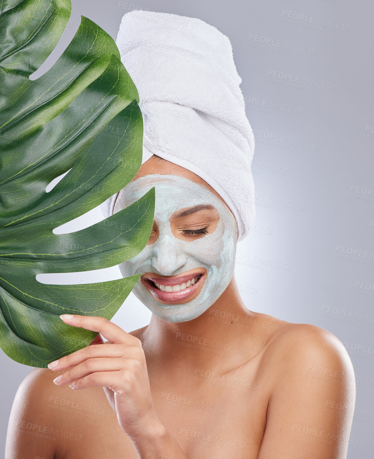 Buy stock photo Leaf, woman and face mask for skincare, cosmetic and facial treatment on white background. Beauty, natural or organic for female person, smile and flower for dermatology detox and exfoliate product