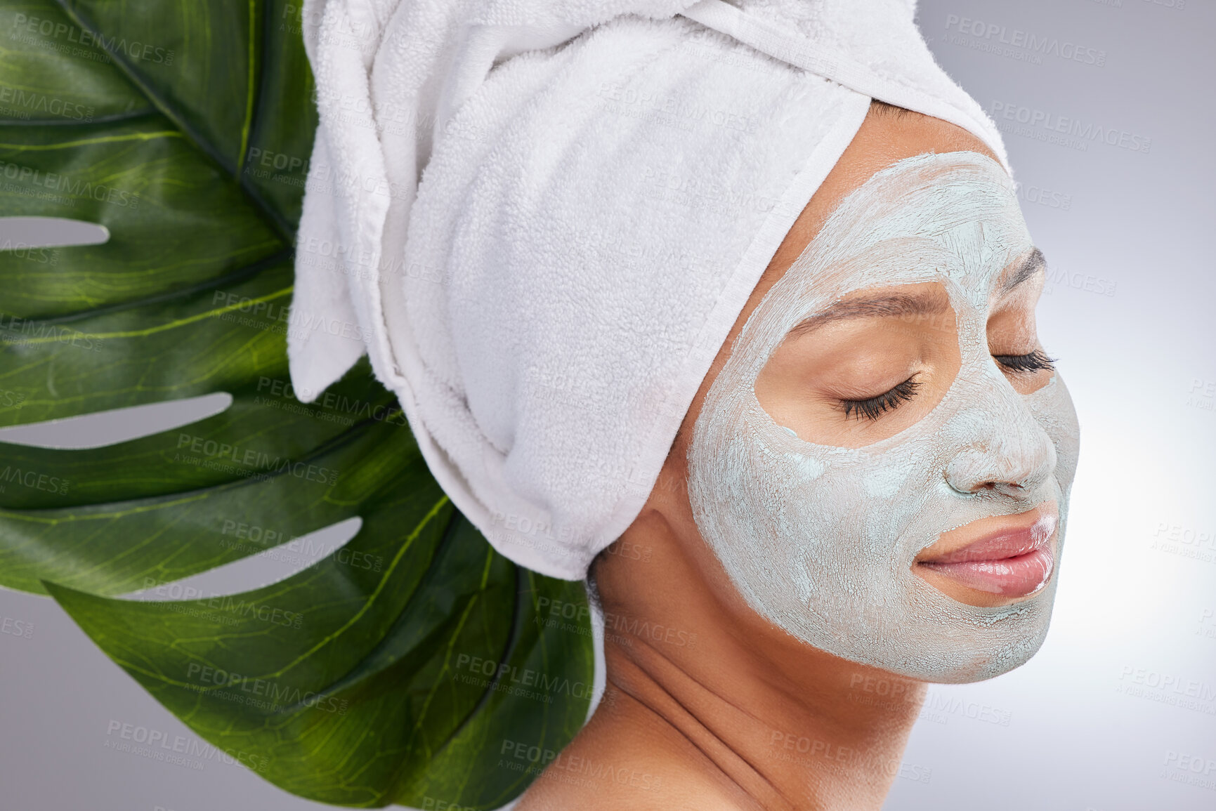 Buy stock photo Leaf, woman and face mask for skincare, cosmetic and facial treatment on white background. Beauty, natural or organic for female person, smile and flower for dermatology detox and exfoliate product