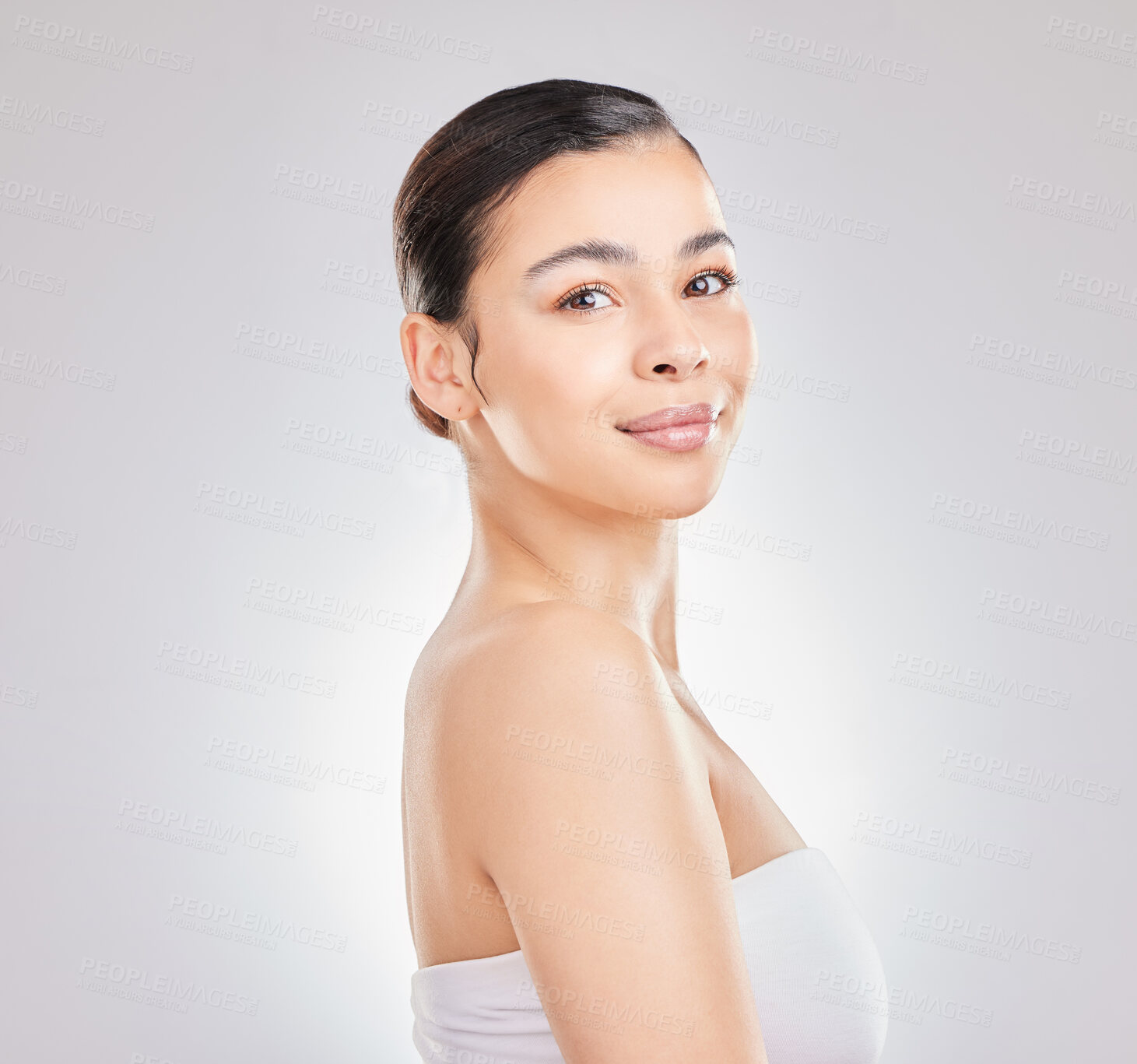 Buy stock photo Woman, portrait and face for wellness, beauty and health in studio with skin glow or shine. Girl, smile and happy for self care, aesthetic and facial transformation on white background in Colombia