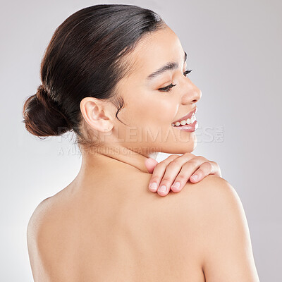 Buy stock photo Shot of a young woman posing against a grey background