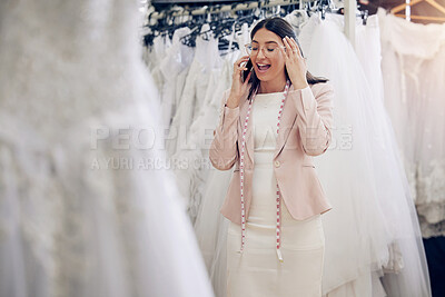 Buy stock photo Phone call, wedding dress and fashion designer woman in studio for communication or planning. Feedback, style and seamstress with tape measure talking on mobile in workshop for fitting appointment