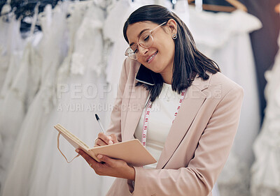 Buy stock photo Notebook, phone call and wedding dress with woman in studio for communication or planning. Style, writing and fashion designer with tape measure talking on mobile in workshop for fitting appointment