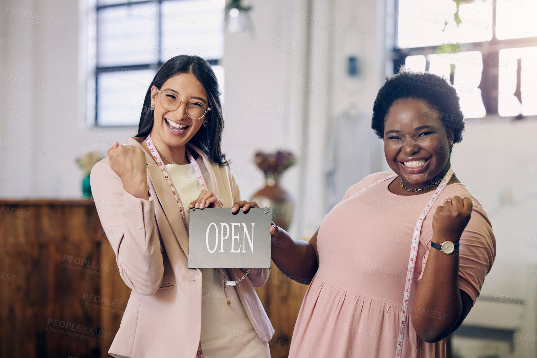 Buy stock photo Shot of two women working together in a boutique