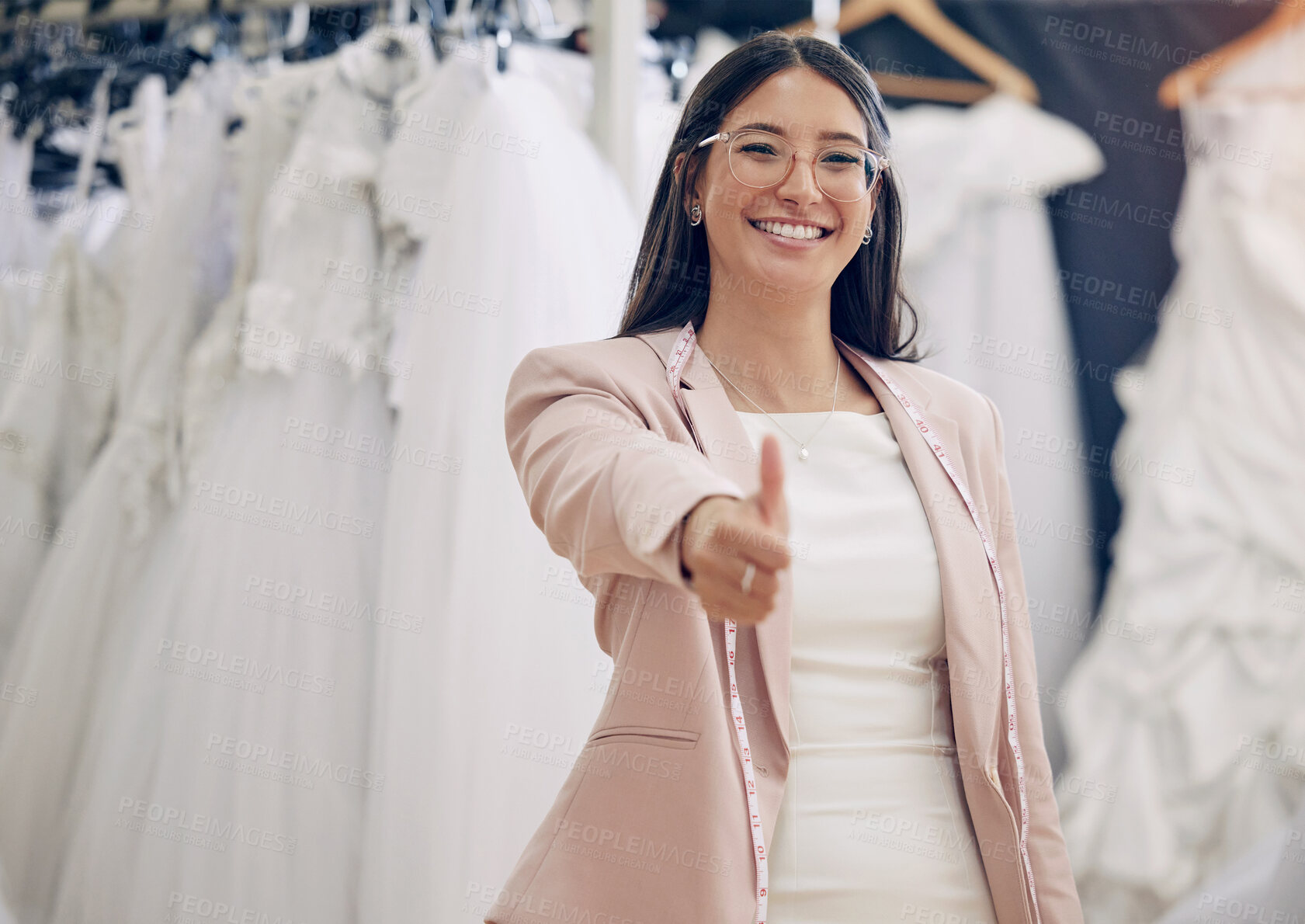 Buy stock photo Portrait, thumbs up and wedding dress with woman in studio for motivation or success. Feedback, review and thank you with happy fashion designer in workshop for like or yes emoji hand gesture